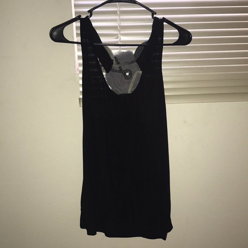 Black tank top with a grey flower in the back